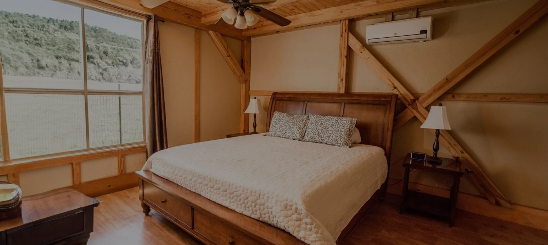 A bed room with a large wooden bed