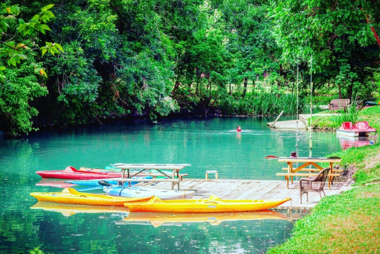 A group of people in canoes on the water.