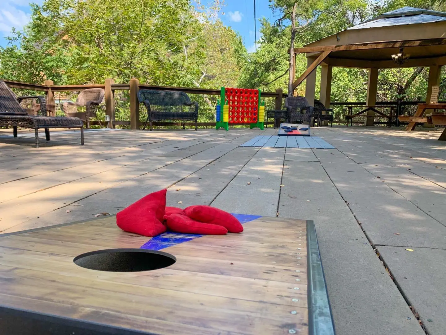 A red towel is on the ground near some benches.