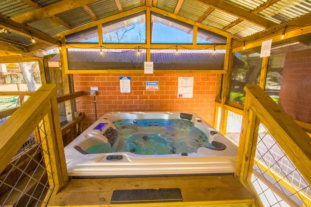 A hot tub in the middle of a room.