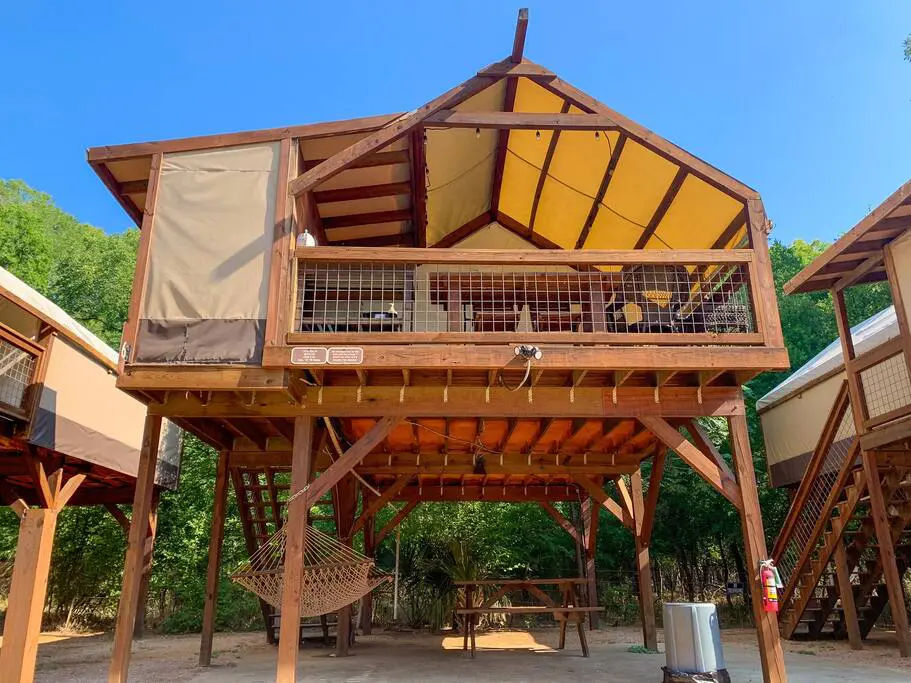 A large wooden structure with a roof and two levels.